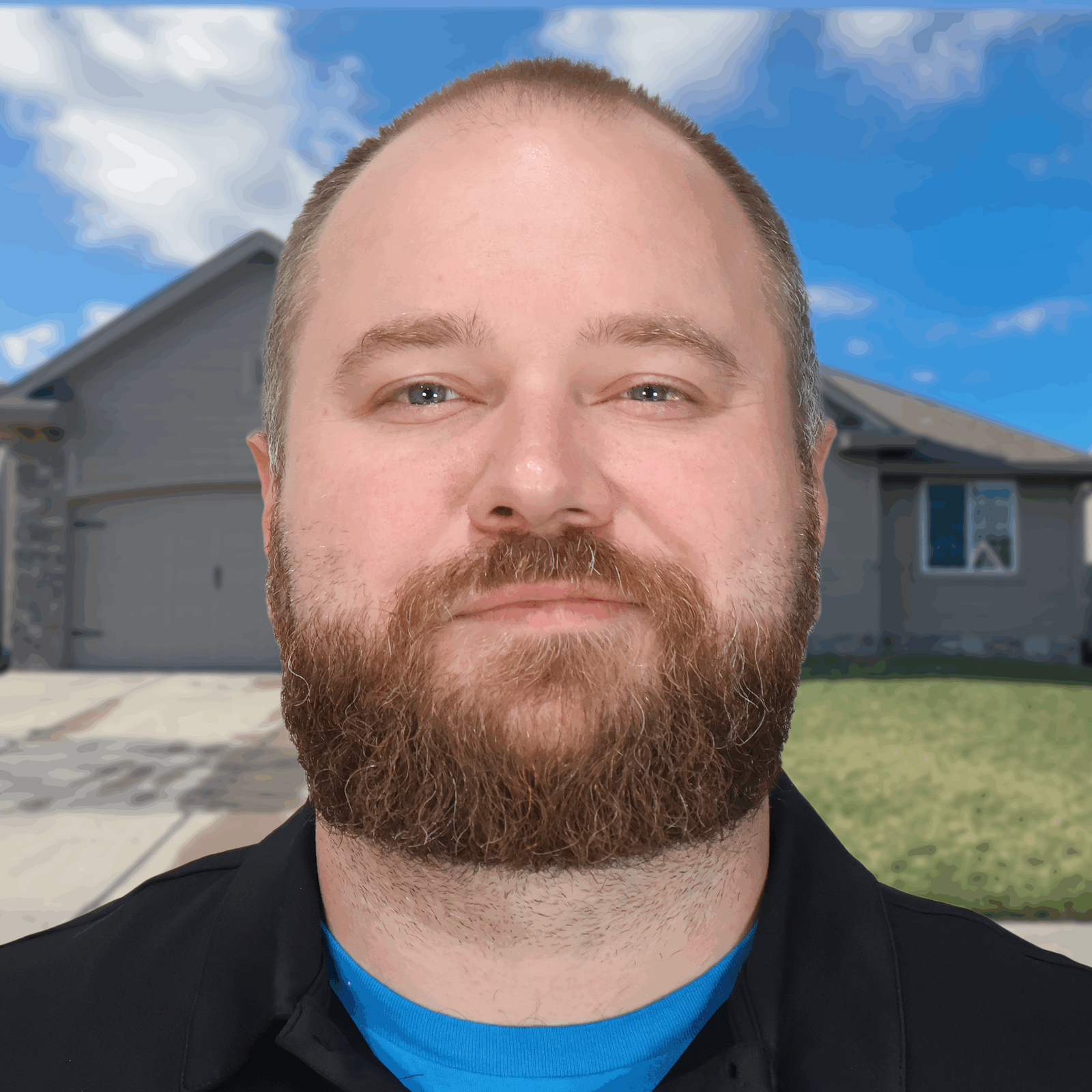 Man standing in front of a house on a sunny day.