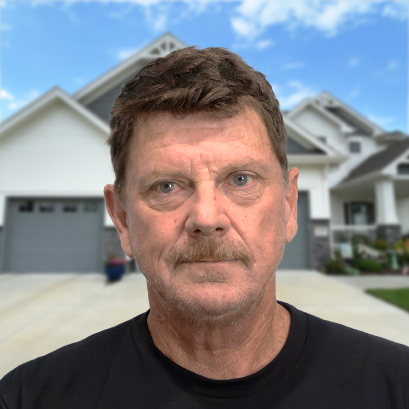 Experienced Omaha roofer in front of a modern suburban home.