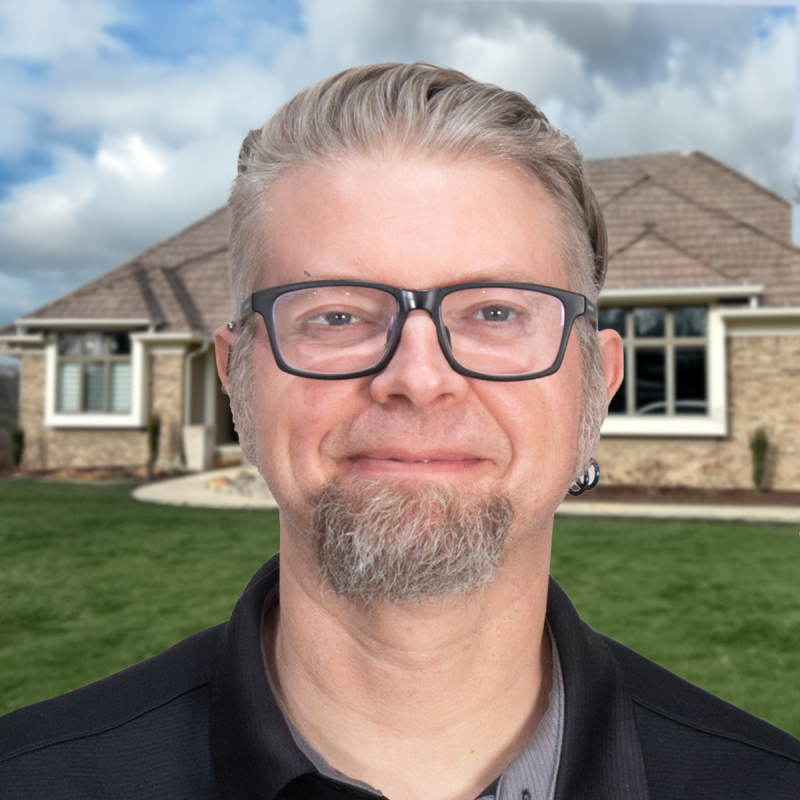 A professional roofer stands in front of a home showcasing quality roofing work.